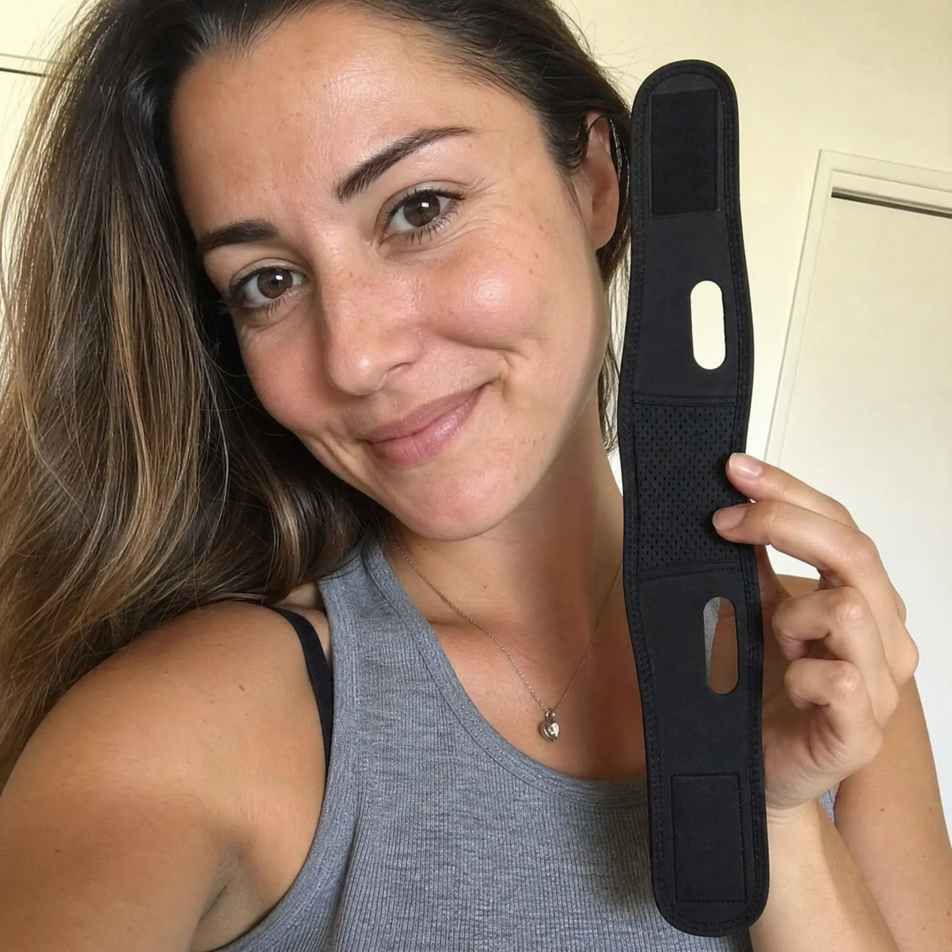 Emily holding her Black JawSnap strap