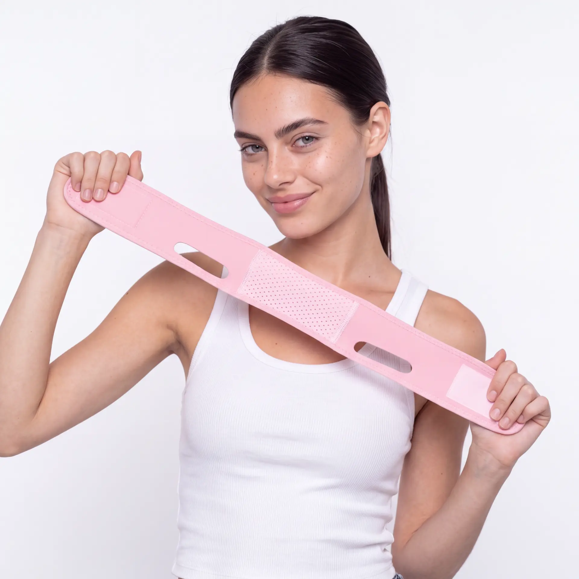 Model holding the JawSnap strap to show length and fit